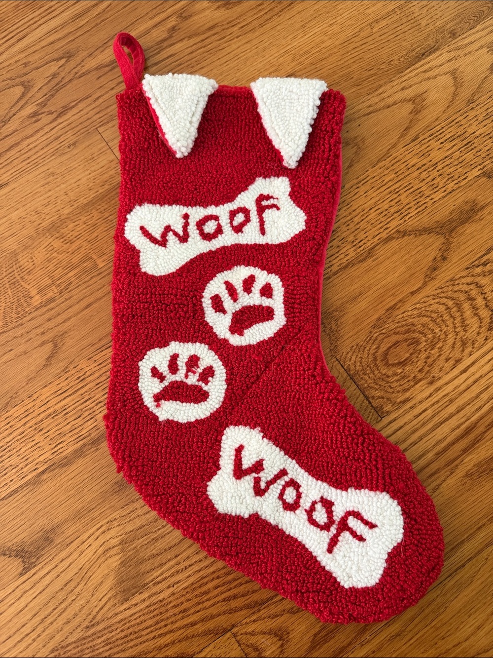 Red Dog-Themed Holiday Stocking with dog ears, bone and paw print design